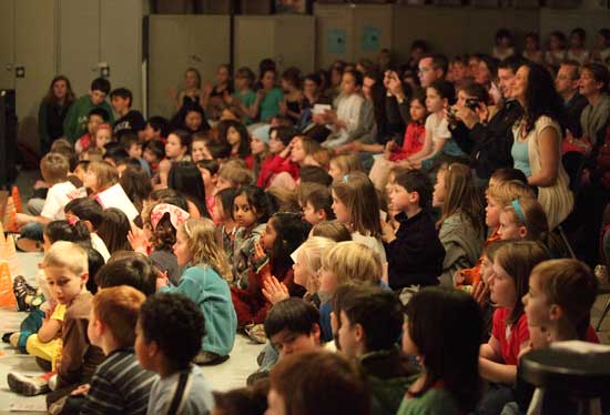 A packed house enjoys the fesitval presentations.